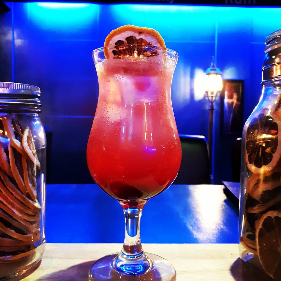  An elegant cocktail served in a glass.