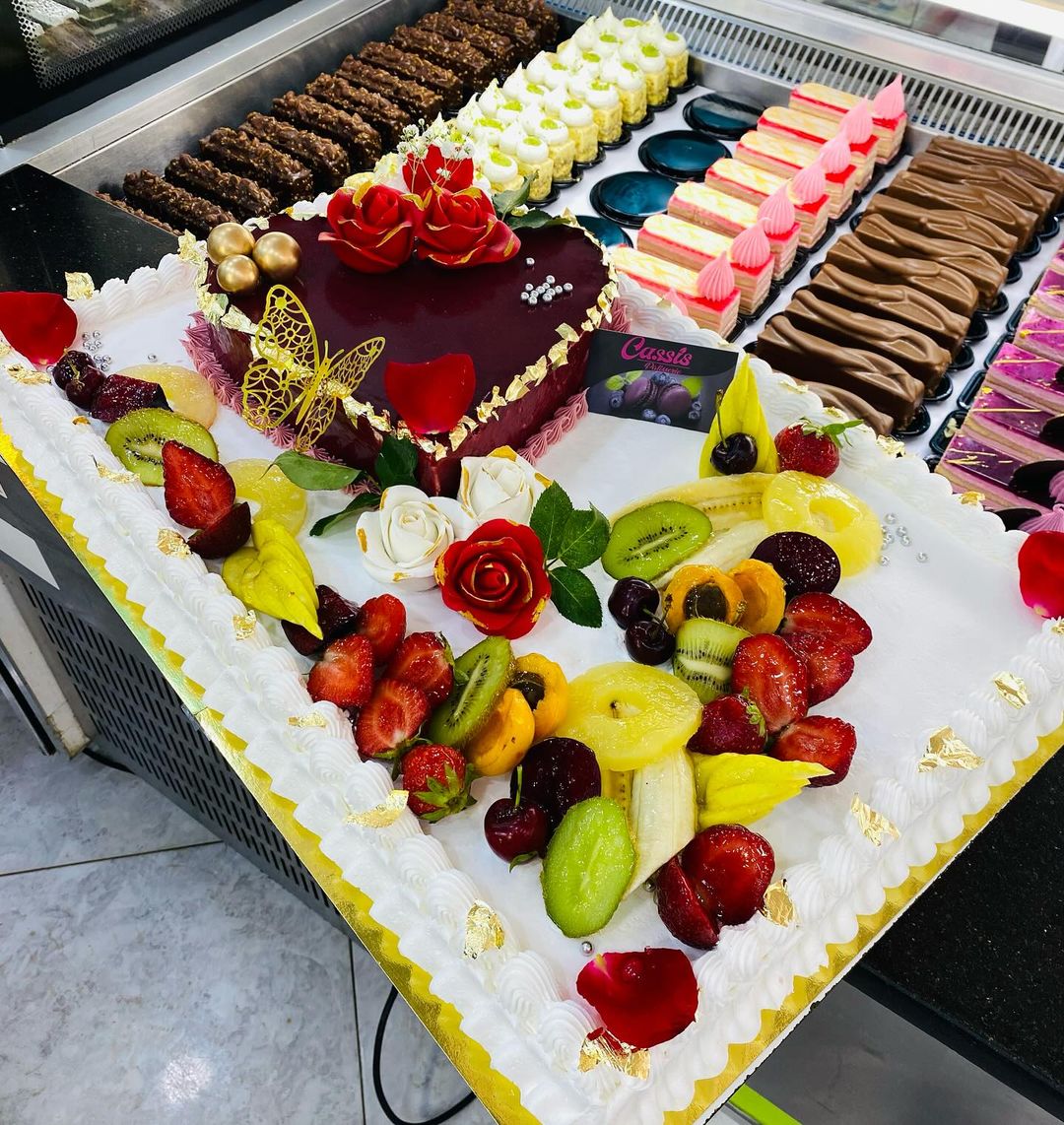 A variety of comforting desserts and cakes on display at a bakery.