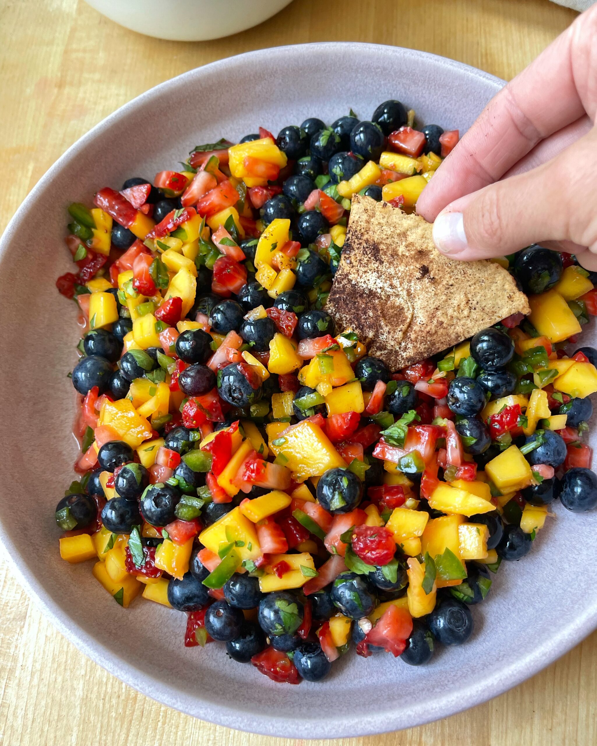 Blueberry mango salsa: a colorful and fruity salsa with a mix of fresh blueberries and ripe mango chunks.