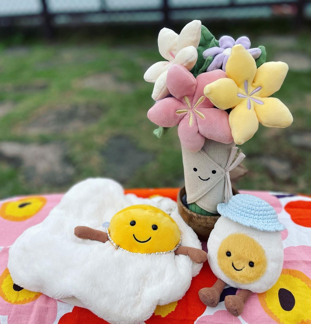 Amuseable Flowers from Jellycat are charming, plush toys with cheerful faces and soft petals, perfect for brightening any day with their playful, huggable design.