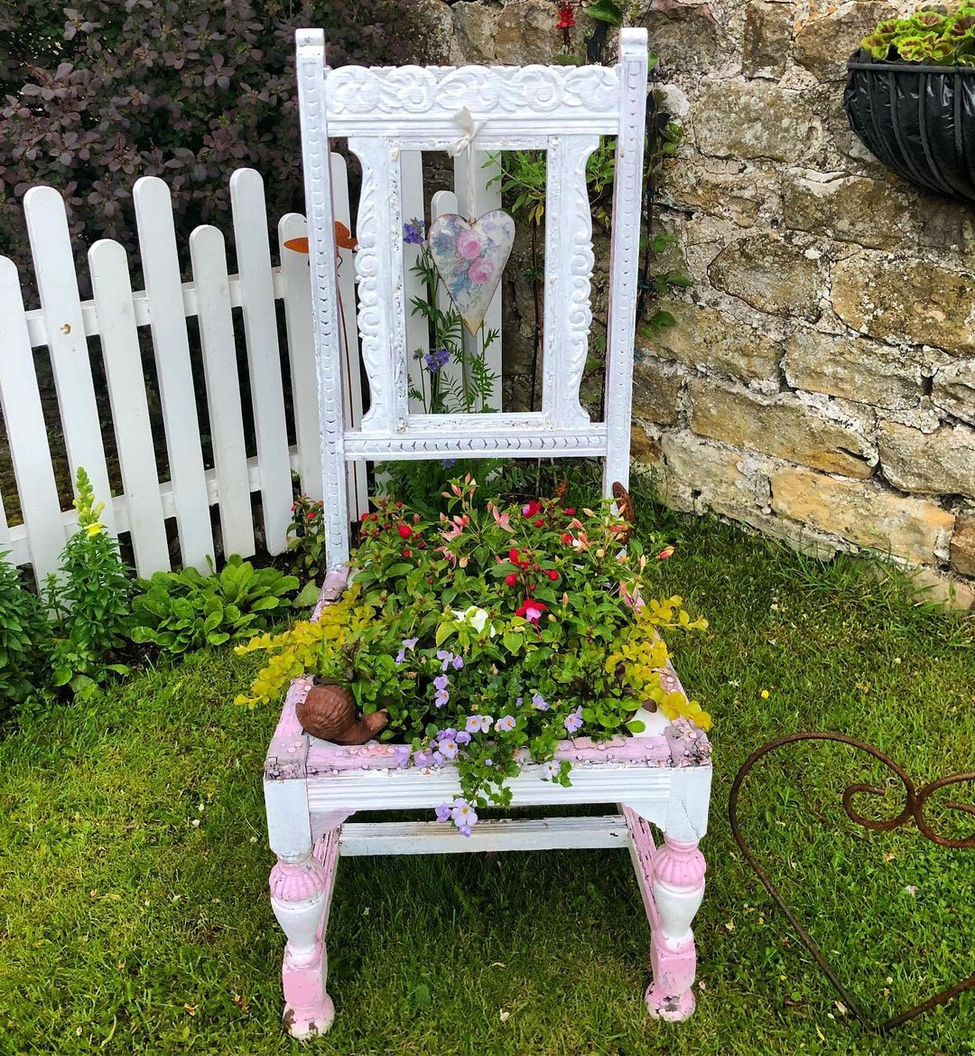 A chair planter is an upcycled garden idea where an old chair is converted into a planter by placing a pot or planting directly into the seat area, creating a unique and decorative plant display.